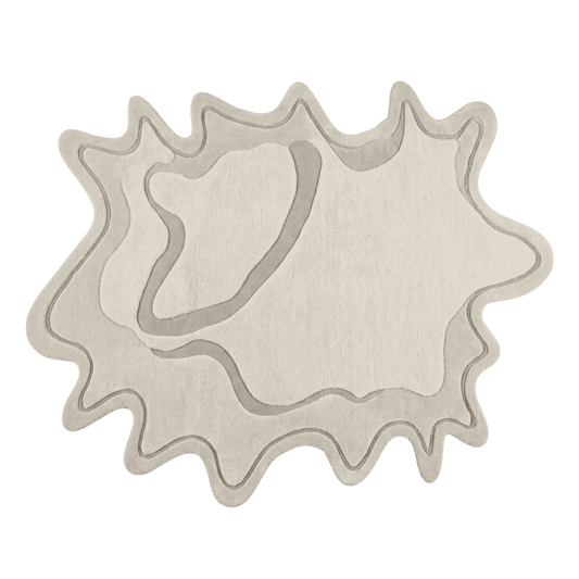 Decorative rug with a unique organic shape with charcoal hue
