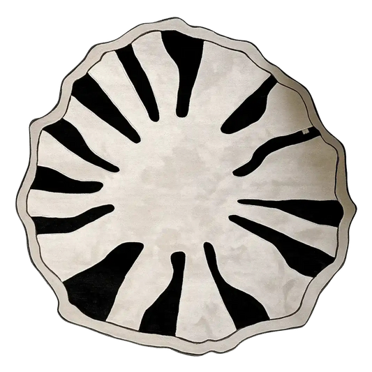 Round decorative rug with black abstract patterns on a white background